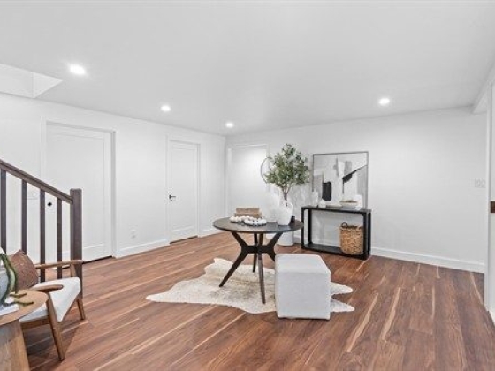 Bright, stylish room featuring a small table and decor.